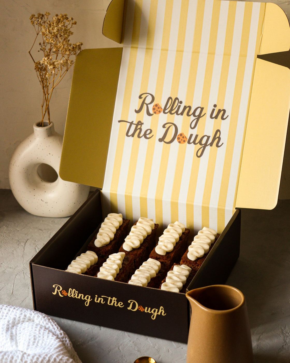 An open box of carrot cake slices